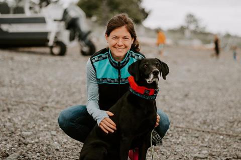 Photo of Christina Knapp Ph.D. with a dog