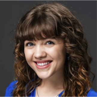 Professional headshot of Christina Treacy, smiling, wearing a blue blouse, against a neutral background.